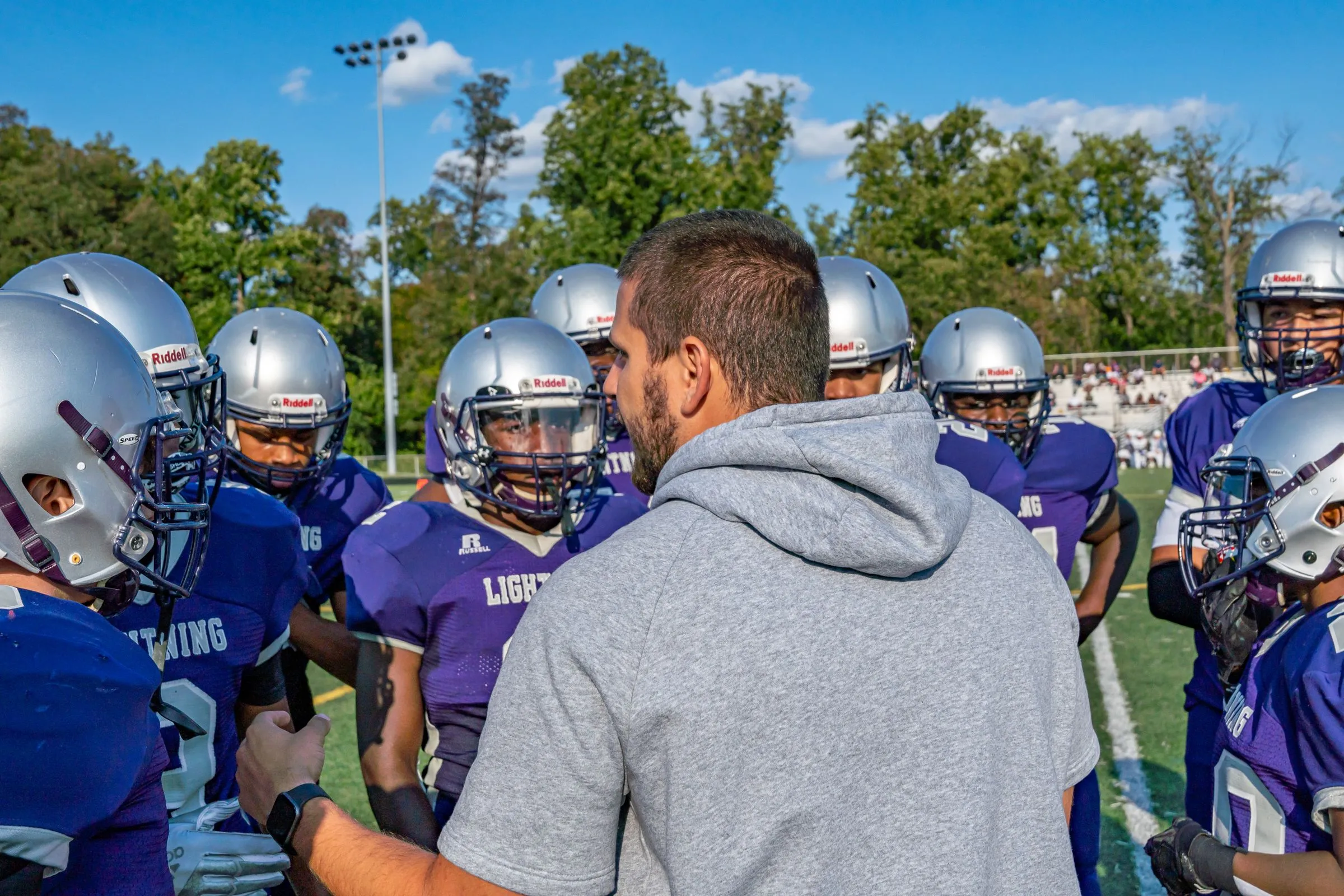 A coach with a young football team